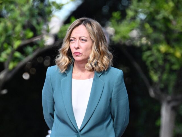 Italy's Prime Minister Giorgia Meloni waits for the arrival of Qatar's Emir Sheikh Tamim b