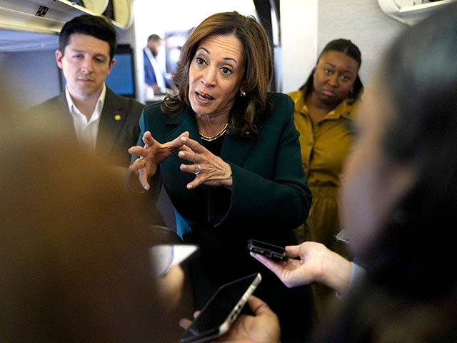 Vice President and Democratic presidential candidate Kamala Harris speaks with members of