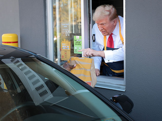 Republican presidential nominee, former U.S. President Donald Trump works the drive-throug