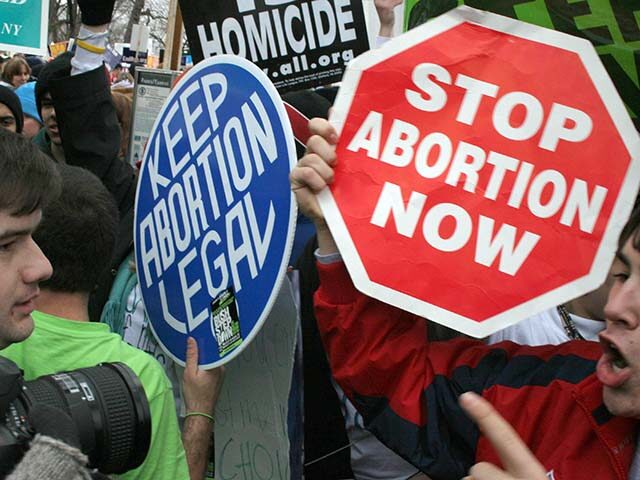 Washington, UNITED STATES: Pro-life demonstrators (R) confront pro-choice counterparts (L)