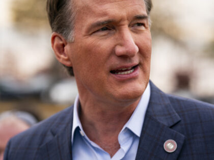 Glenn Youngkin, governor of Virginia, speaks with voters during a campaign stop at a polli