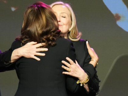 HOUSTON, TEXAS - AUGUST 1: Hillary Clinton hugs Vice President Kamala Harris during a cele