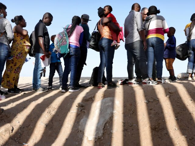 YUMA, ARIZONA- MAY 20: Immigrants from Haiti, who crossed through a gap in the U.S.-Mexico