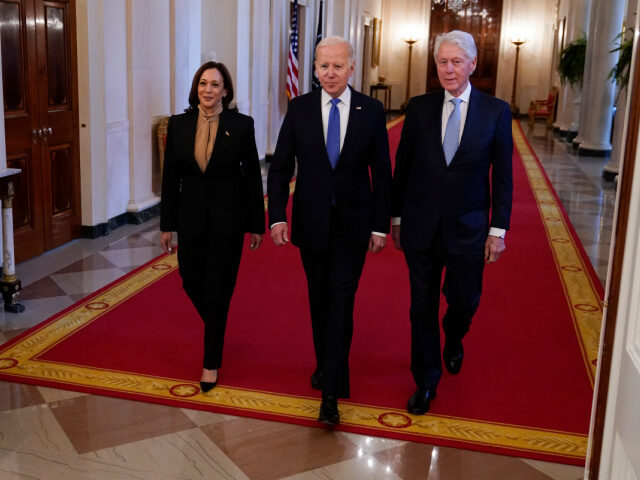 President Joe Biden arrives with Vice President Kamala Harris and former President Bill Cl