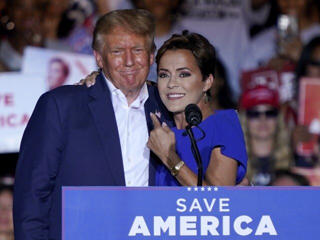 FILE - Arizona Republican gubernatorial candidate Kari Lake, right, speaks as former Presi