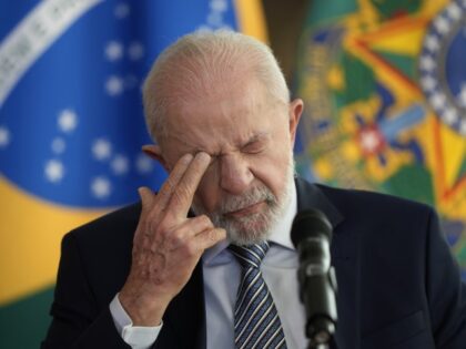 Brazilian President Luiz Inacio Lula da Silva pauses before answering a journalist's