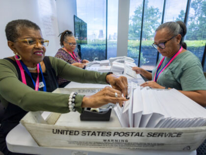 From left, Carol Hamilton, Cristo Carter and Cynthia Huntley prepare ballots to be mailed