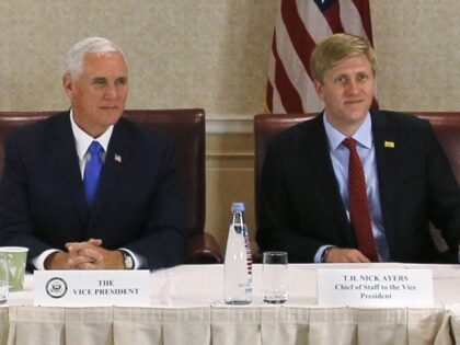 In this Aug. 1, 2017 file photo, Vice President Mike Pence, left, attends a meeting with G