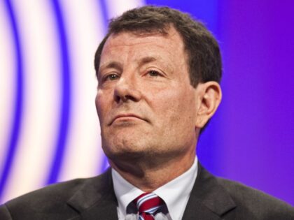 The New York Times columnist Nicholas Kristof listens during the Clinton Global Initiative