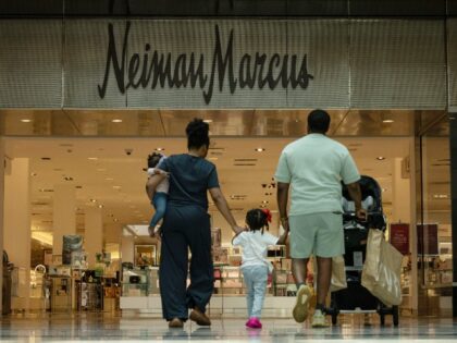 Shoppers enter a Neiman Marcus store in Garden City, New York, US, on Friday, July 5, 2024