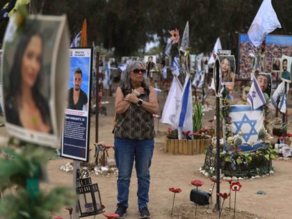 A woman visits an installation honouring those who were killed and kidnapped in the Supern