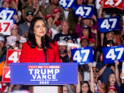 Tulsi Gabbard, former US Representative from Hawaii, left, and former US President Donald