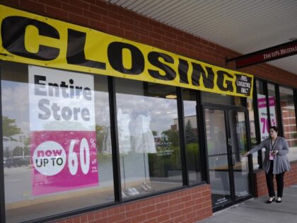 The closing sign and entire store sign are displayed at a retail store's window in Ve