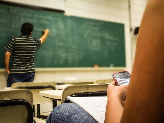 Student using phone in class