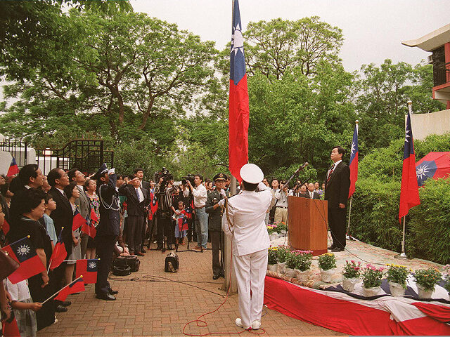 Taiwan's counsellor Joseph T. Shih (R) and about a hundred spectators gathered at the emba