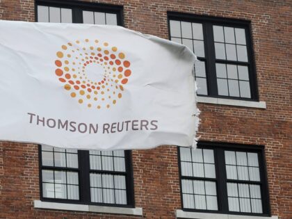 FILE-- A flag displaying the Thomson Reuters logo flies outside a company building, Monday