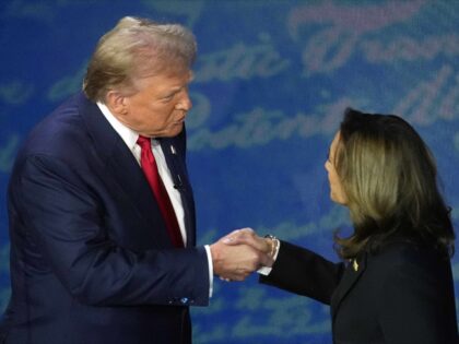 Republican presidential nominee former President Donald Trump shakes hands with Democratic