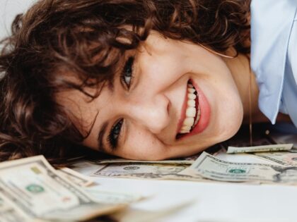 Woman smiling with money