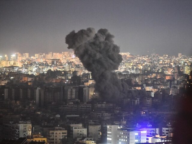 Smoke rises from the site of an Israeli airstrike that targets a neighborhood in Beirut&#0