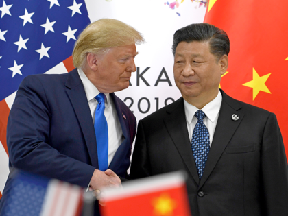 President Donald Trump shakes hands with Chinese President Xi Jinping during a meeting at