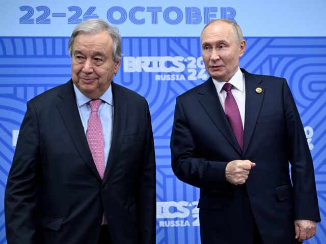 Russian President Vladimir Putin (R) greets United Nations (UN) Secretary General Antonio