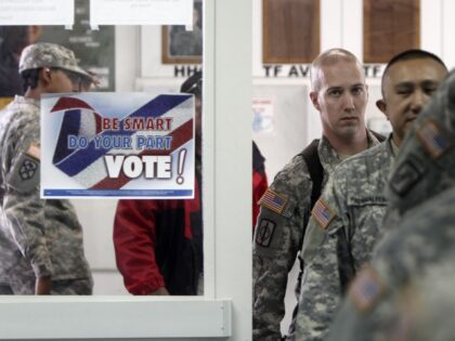 U.S. Army soldiers, members of the NATO-led peacekeeping force in Kosovo, walk inside a di