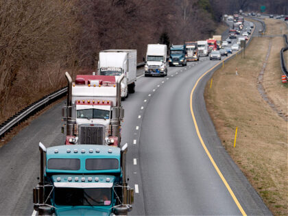 Participants of the Peoples Convoy drive the beltway around Washington, DC, near Cabin Joh