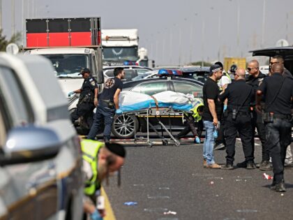 Members of Israel's ZAKA search and rescue emergency services transport a body, reportedly