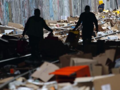 LOS ANGELES, CA - JANUARY 15: People collect items on a section of Union Pacific train tra