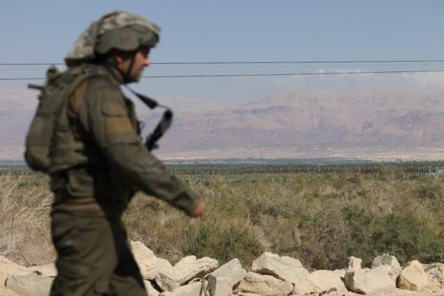 An Israeli soldier patrols the area south of the Dead Sea where the army said two attacker