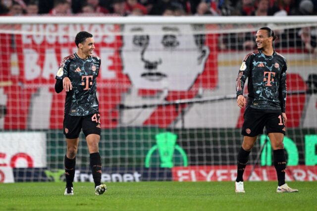 Bayern Munich midfielder Jamal Musiala (L) scored a hat-trick against Mainz