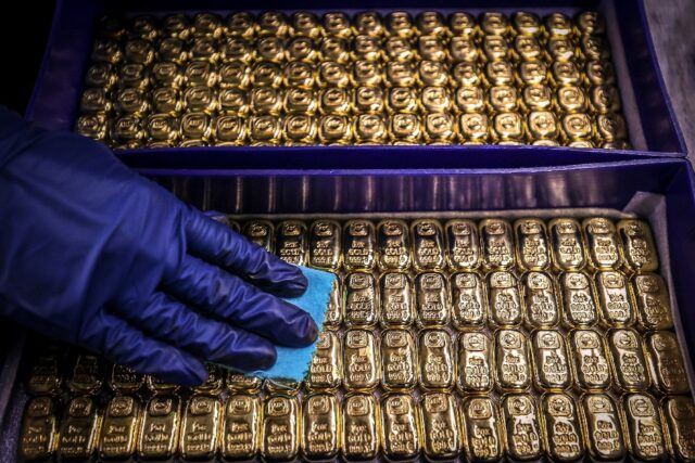 Bullion hit a fresh record high on geopolitical tensions as traders keep track of developm