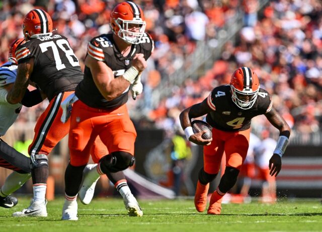 Cleveland quarterback Deshaun Watson, right, falls to the turf with what proved to be a se