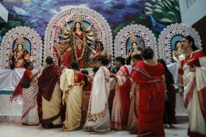 Devotees offer prayers to a Hindu goddess 'Durga' idol in Dhaka