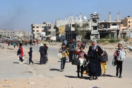 Displaced Palestinians fleeing Israeli military operations in Beit Lahia in the northern G