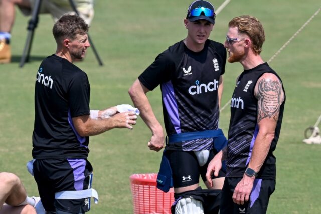 England's captain Ben Stokes (R) with teammates Joe Root (L) and Harry Brook (C) attend a