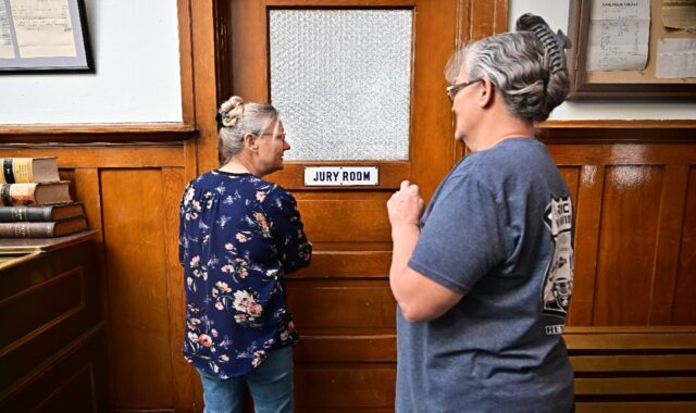 Esmeralda County clerk Cindy Elgan (L) and deputy clerk Lori Baird stand at the doorway to