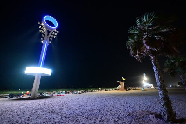 Floodlights illuminate the Umm Suqeim beach in Dubai to make it safer for beachgoers at ni