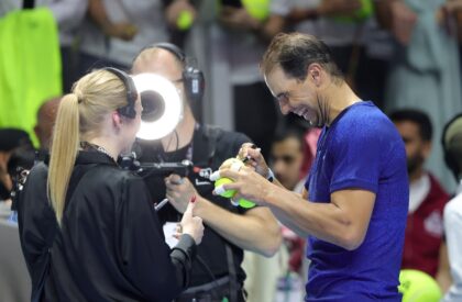 'Trying to have fun': Rafael Nadal signs tennis balls after he was defeated by Carlos Alca