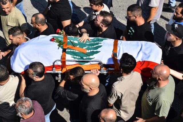 The funeral of Reuters journalist Issam Abdallah, killed in an attack by an Israeli tank i