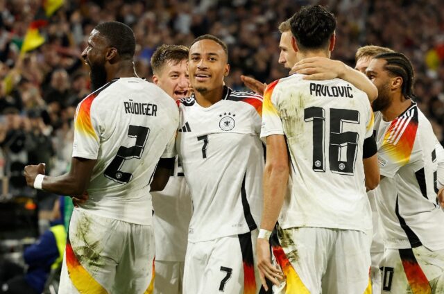 Germany's number seven Jamie Leweling celebrates with teammates after scoring against the