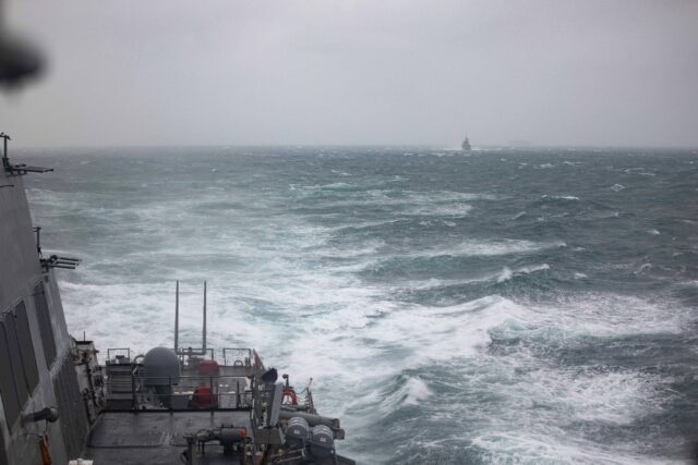 A handout photo taken on October 20 by the US Navy shows the USS Higgins (foreground) and