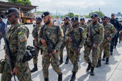 Jamaican soldiers and police officers arrive at Toussaint Louverture International Airport