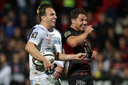 Joy: Antoine Dupont shares a joke with Clermont fly-half Benjamin Urdapilleta