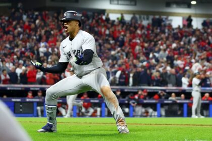 Juan Soto of the New York Yankees celebrates after hitting the three-run homer in the 10th