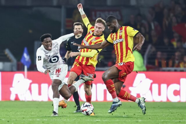 Late show: Lille forward Jonathan David (L) in action