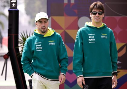 'Love for racing': Fernando Alonso (L) and Aston Martin teammate Lance Stroll arrive for p