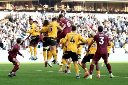 Manchester City's John Stones rises to score the winner against Wolves