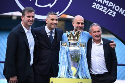 Manchester City manager Pep Guardiola (2R) with director of football Txiki Begiristain (R)