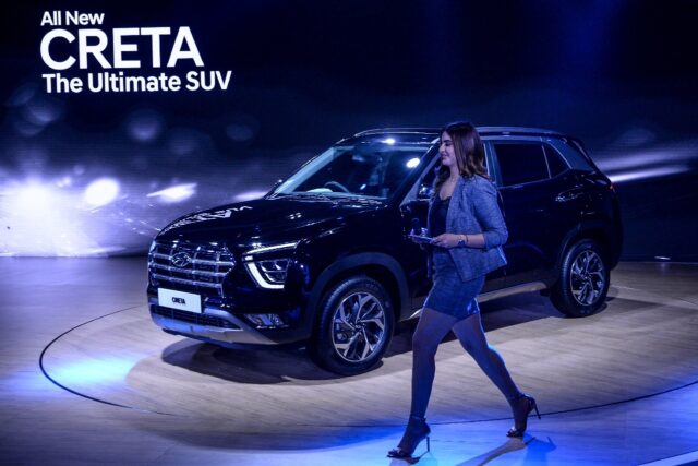 A model walks past the Hyundai Creta SUV in New Delhi in 2020.